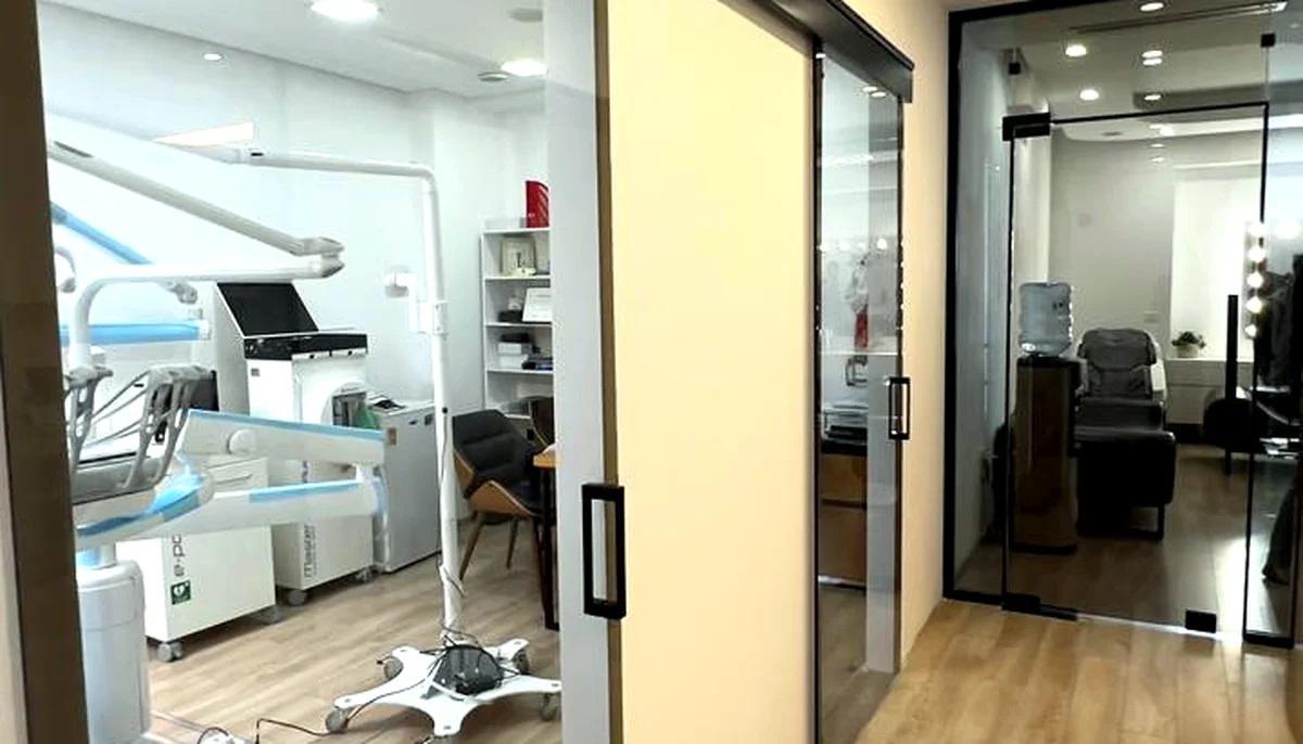 Corridor with glass doors to treatment rooms at our Tirana clinic